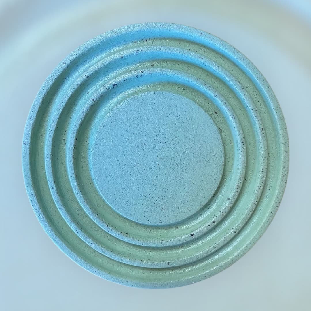 Portavasos Áurea de concreto en verde menta, visto desde arriba